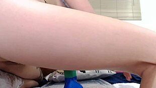 This young babe with a big pussy is sitting on a colorful dildo all the way to the hilt. She loves every inch of it.