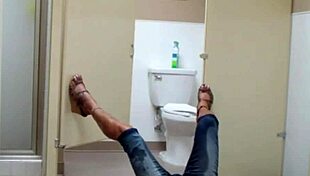 staci performs on the bathroom floor in public outdoor setting with fetish elements