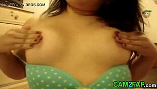 Amateur babe feels intense pleasure during webcam tits massage