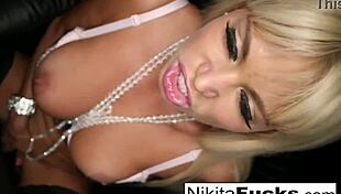 I watch nikita von james, the blonde milf, play with her big tits and pussy.