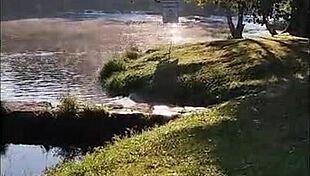 The prostitute enjoys a hot fuck in the river, getting pounded hard by a client in the water.