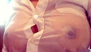 Young Woman Engages in Wet Shirt Pussy Masturbation on Webcam