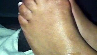 ebony babe gives suggestive footjob to amateur