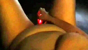 Cute milf fingers her hot pussy while watching porn