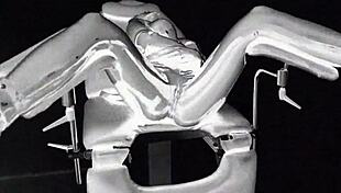 Latex Catsuit In Medical Chair