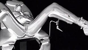 Latex Catsuit In Medical Chair