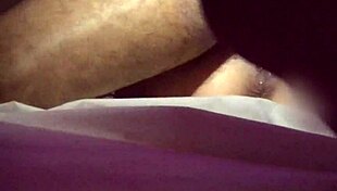 husband patiently waits while wife enjoys time with the young guy