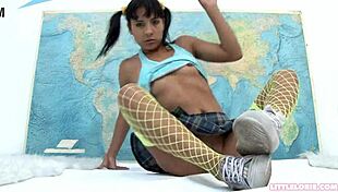 Little Lorie teases her pussy with toys in stockings