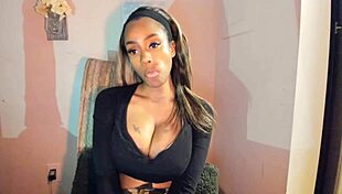 this tattooed ebony milf with big tits is fingering her pussy