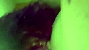 The purple haired girl eagerly sucks his cock in the room.