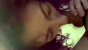 The purple haired girl eagerly sucks his cock in the room.