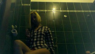 blonde slut with tattoos gets wet and horny in toilet.