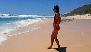 Sandy ass flaunting red butt plug at paradise beach