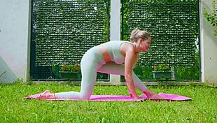 Stella Cardo does sexy outdoor yoga, showing off her big tits and ass