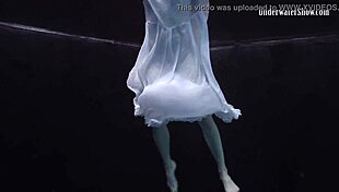 andrejka stuns with incredible underwater moves. her wet body glides effortlessly in the pool.