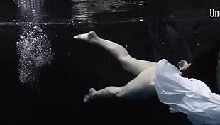 andrejka stuns with incredible underwater moves. her wet body glides effortlessly in the pool.
