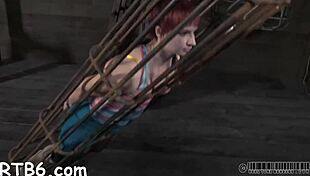 Attractive Playgirl Is Hung Up And Receives Punishment In A Dim Garage Setting