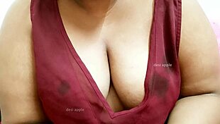 Asian sexy aunty flaunts her big tempting boobs.
