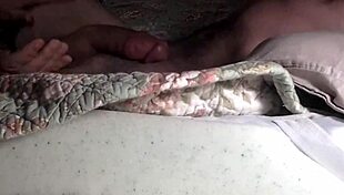 Submissive individual engages in sucking activity