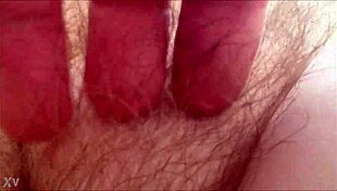 rubbing her hairy milf pussy at home 😈