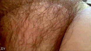 rubbing her hairy milf pussy at home 😈