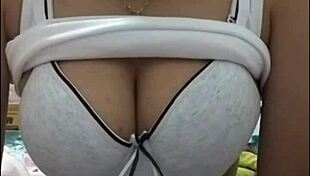 Girl with big tits performs on webcam show.