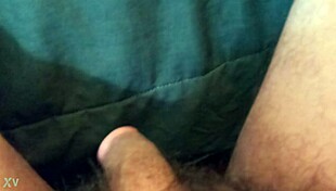 the guy plays with his cock in a casual way.