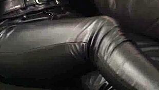 This rock chick struts in leather pants and a biker jacket.