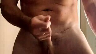 Muscular bodybuilder gets horny in the bathroom for a cumshot