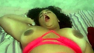 A brunette Brazilian babe indulges in solo masturbation, teasing her ass and pussy.