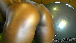 Ebony freak intensely rides the exercise ball.