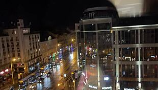Fitness model stretches in yoga session with director's guidance
