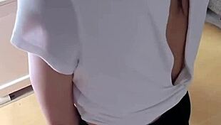 sexy mature woman uses vibrator on wet pussy while watching porn alone.