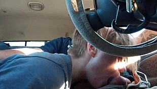 Driving down the road, he gets a blowjob from a guy with socks on his black cock