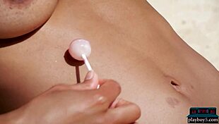 Angel Constance, the stunning Indian milf, lounges outdoors showcasing her big natural tits for Playboy