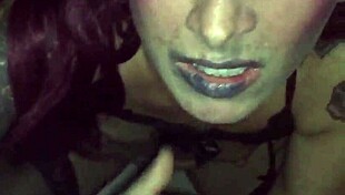 TATTOED CHICK SUCKS STRANGER IN VIDEO BOOTH