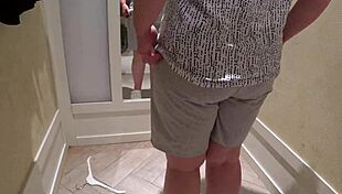 hidden camera captures a mature pawg milf in the fitting room, trying on shorts with close-up fetish views of her big ass in panties.