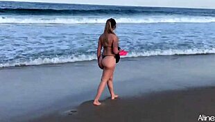 Blonde girl fucked doggystyle on beach.