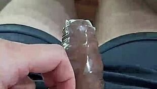 Slow motion removal of condom in homemade video with cute neighbors.