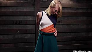 How does this masochistic blonde slave get trained in the dungeon?