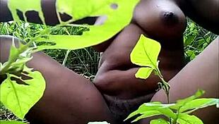Tribal african fingering herself in the woods 😏