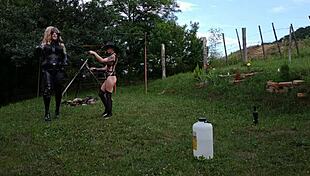 Beth Kinky, sexy goth domina, trains her shemale slave in public bdsm session part 2