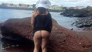 The seductive stepmom lures on a public beach