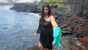 The seductive stepmom lures on a public beach