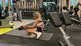 After gym, this cute blonde dragged a guy to bed and fucked him doggystyle.