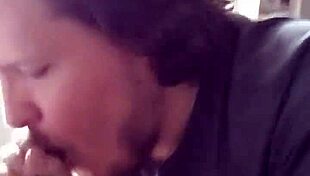 This guy eagerly sucks on a massive black cock in a casual encounter.