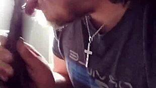 This guy eagerly sucks on a massive black cock in a casual encounter.