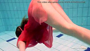 I have firm big tits in a red dress underwater.