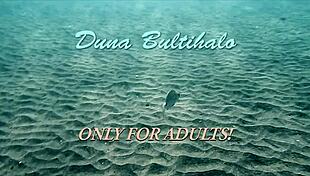 I have firm big tits in a red dress underwater.