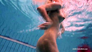 I have firm big tits in a red dress underwater.